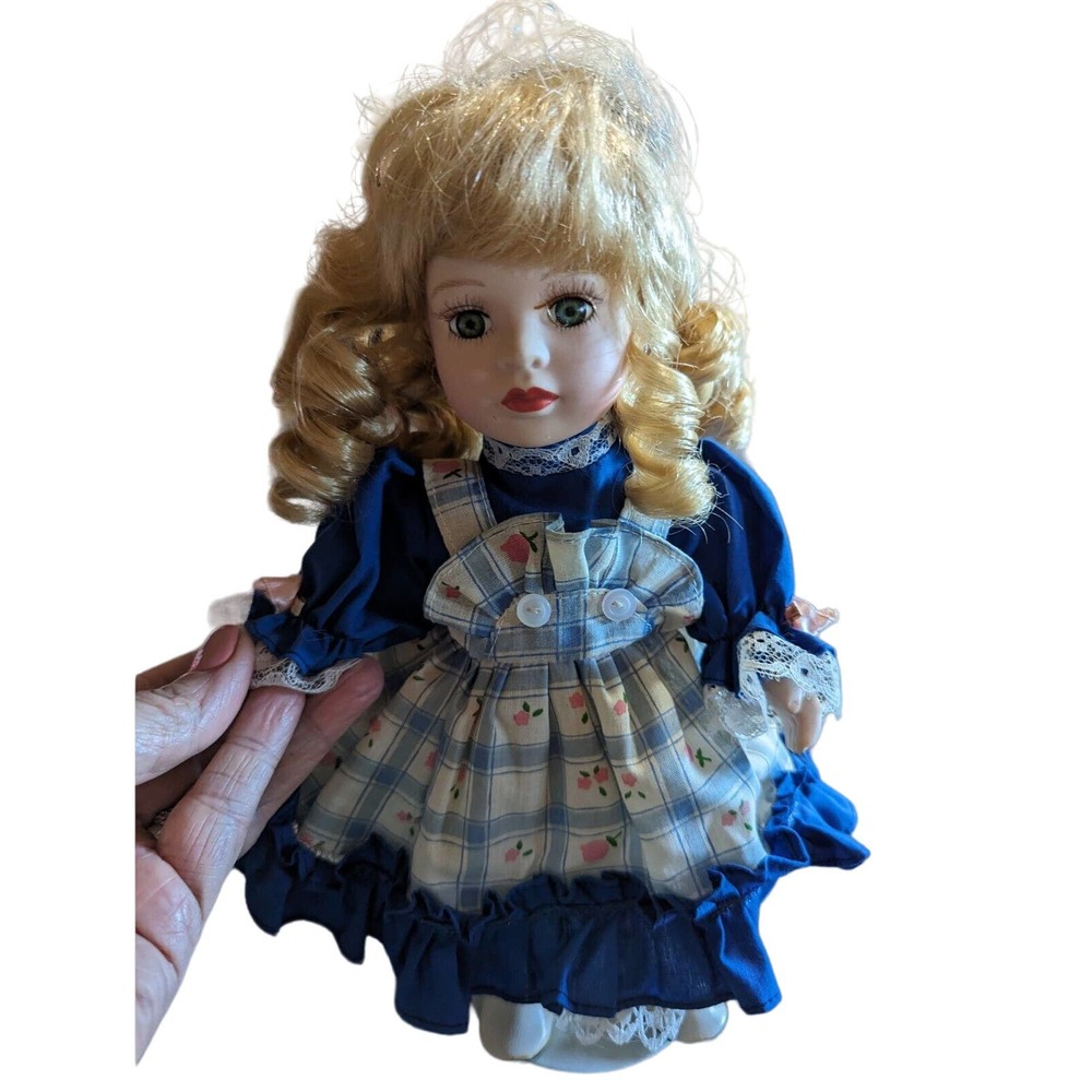 VintagecPorcelain Doll by Cuddle Wit With Stand. Blonde Hair/Blue Eyes